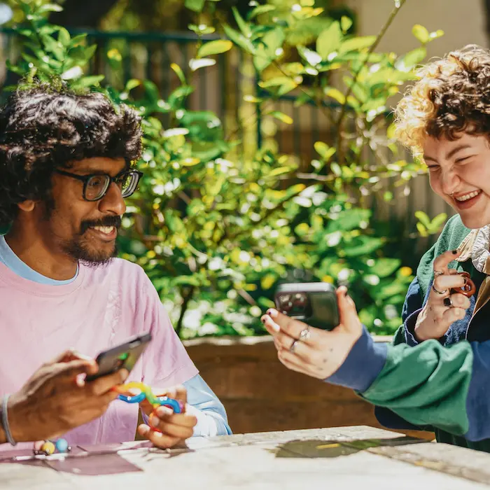 people looking at phones