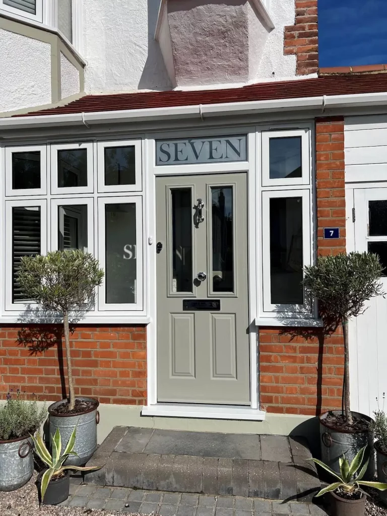 Composite door with toplight and flush sash windows