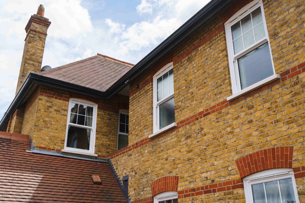 ECOSlide vertical sliding windows sit proudly on a traditional property in Hornchurch, UK. These windows are white.