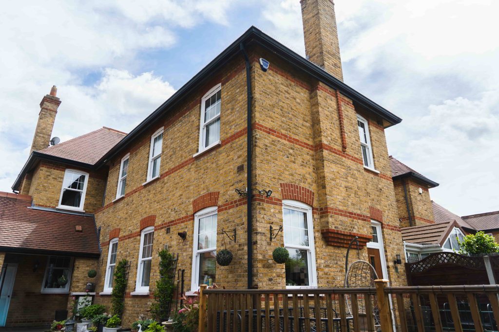 How Local Window and Door Installers Solve Snagging Issues Faster Than National Firms 1 ECOSlide vertical sliding windows sit proudly on a traditional property in Hornchurch, UK. These windows are white.