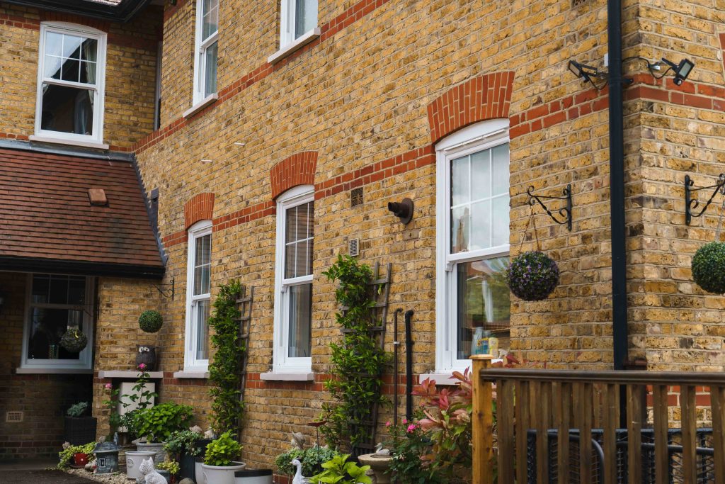 ECOSlide vertical sliding windows sit proudly on a traditional property in Hornchurch, UK. These windows are white.