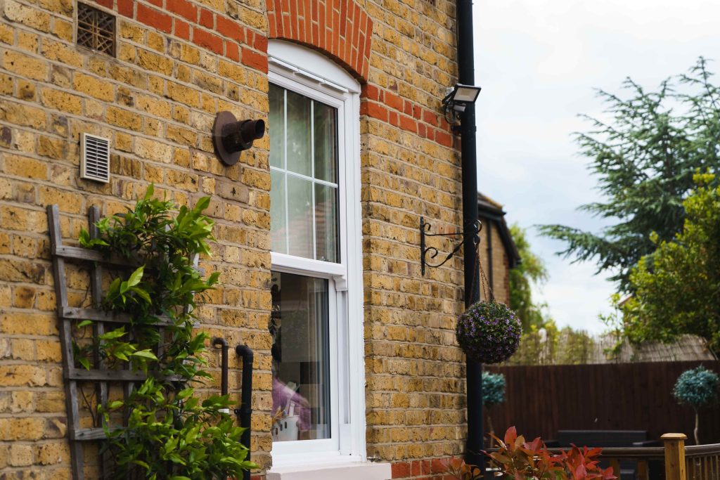 ECOSlide vertical sliding windows sit proudly on a traditional property in Hornchurch, UK. These windows are white.