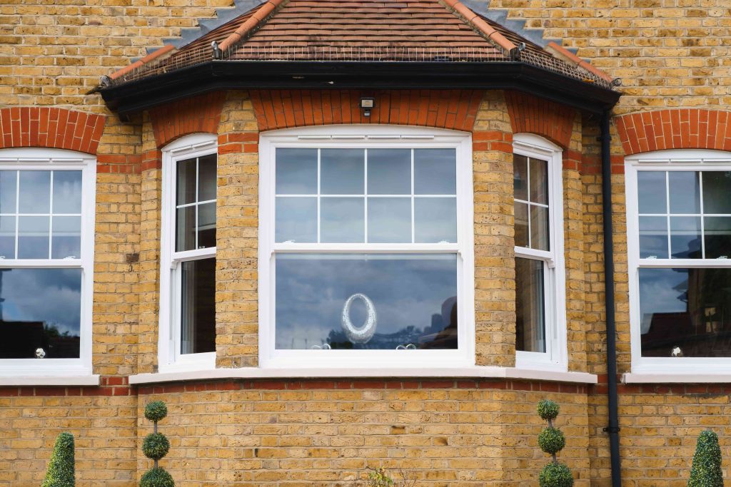 ECOSlide vertical sliding windows sit proudly on a traditional property in Hornchurch, UK. These windows are white.